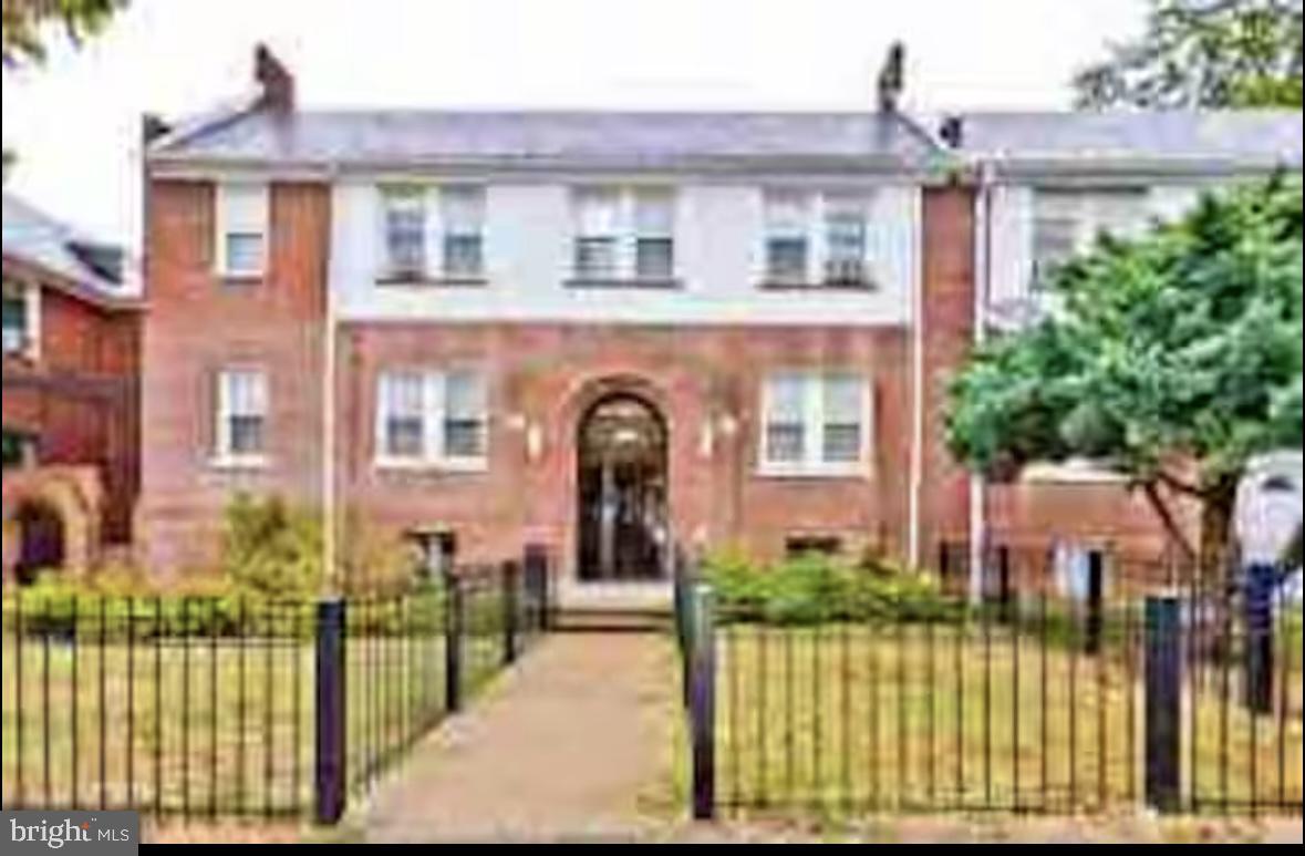 1268 Raum Street Northeast Washington, DC 20002 - Photo 29 of 46 front view of a brick house with a large windows