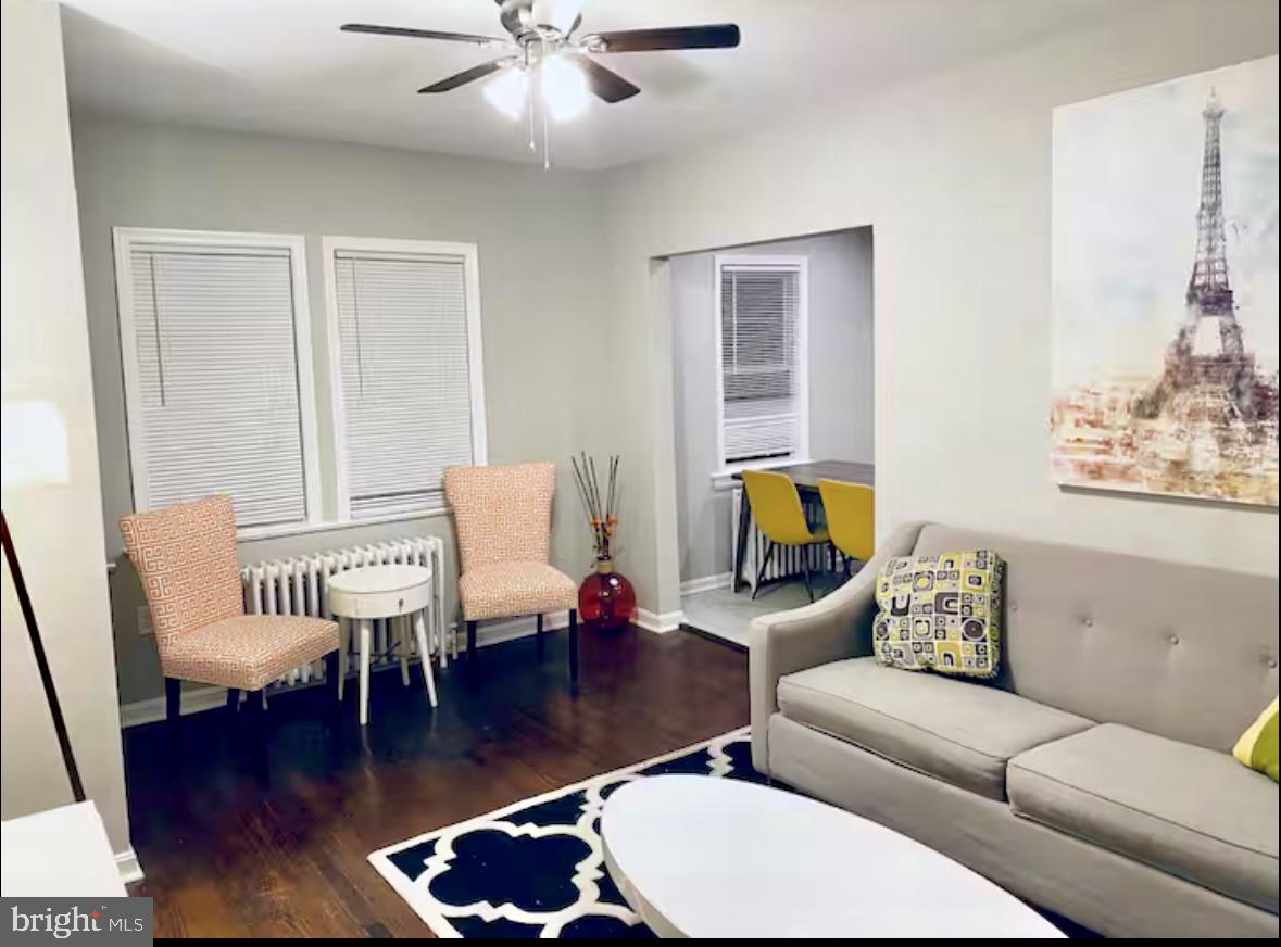 1268 Raum Street Northeast Washington, DC 20002 - Photo 31 of 46 a living room with furniture and a wooden floor