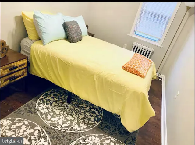 a living room with furniture and flowers