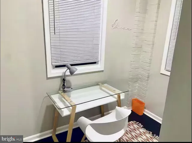 a bathroom with a toilet sink and shower