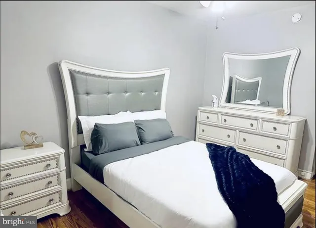 a bathroom with a toilet a sink and a mirror