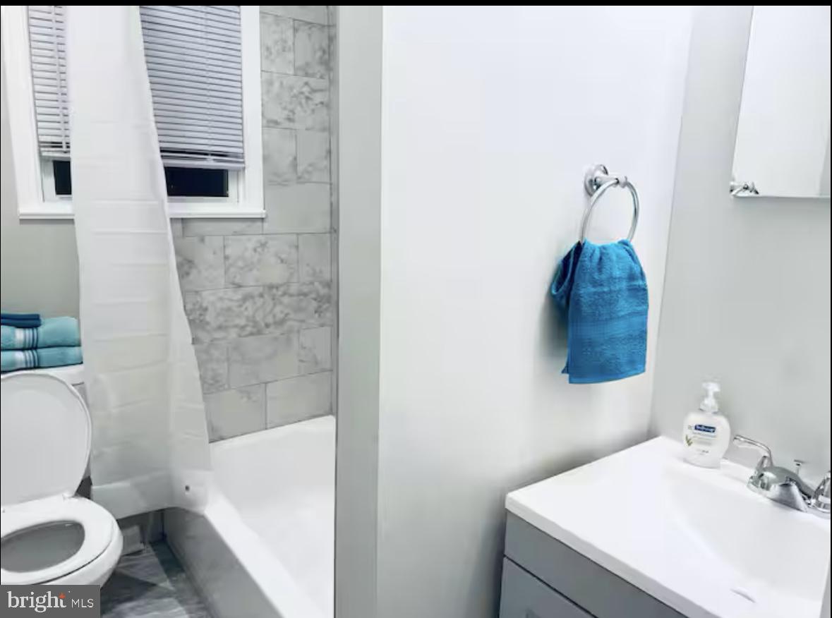 1268 Raum Street Northeast Washington, DC 20002 - Photo 41 of 46 a bathroom with a toilet sink and shower