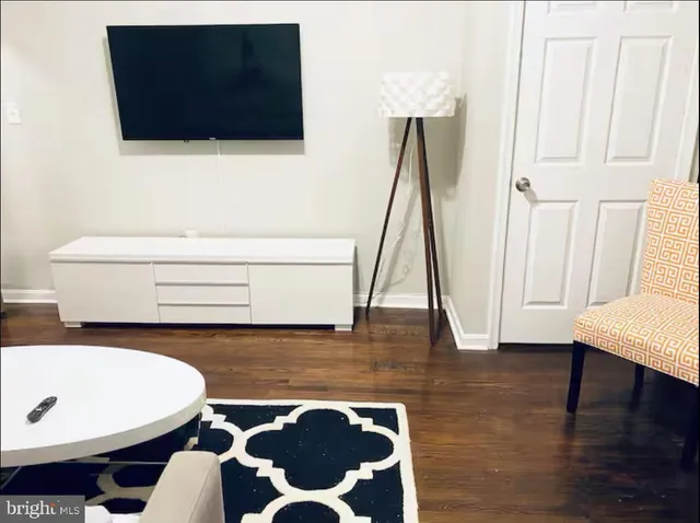 a large bed sitting in a bedroom and lamp