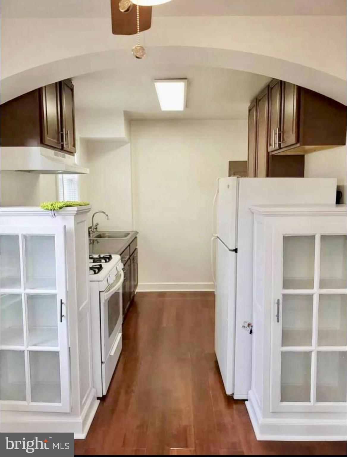 1268 Raum Street Northeast Washington, DC 20002 - Photo 43 of 46 a kitchen with a refrigerator and a stove top oven