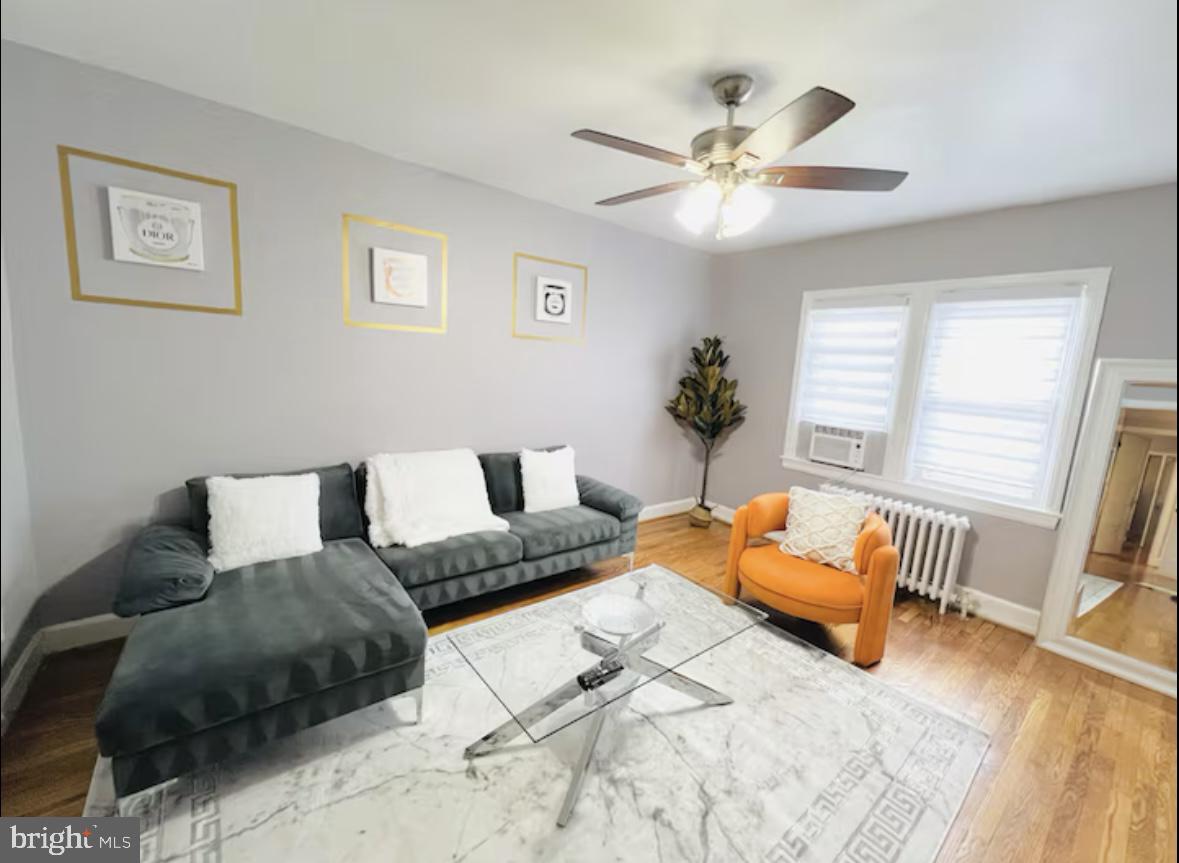 1268 Raum Street Northeast Washington, DC 20002 - Photo 6 of 46 a living room with furniture and a chandelier