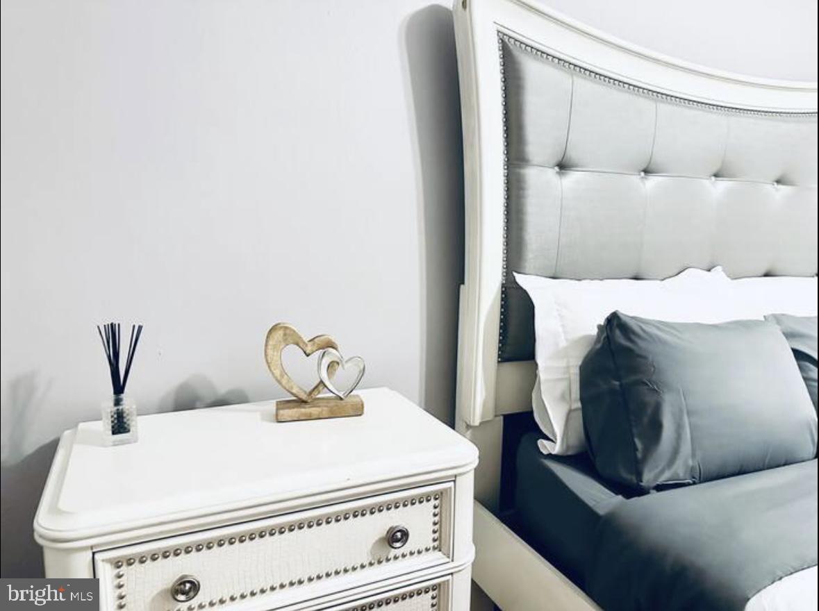 1268 Raum Street Northeast Washington, DC 20002 - Photo 8 of 46 a bedroom with a bed and a window