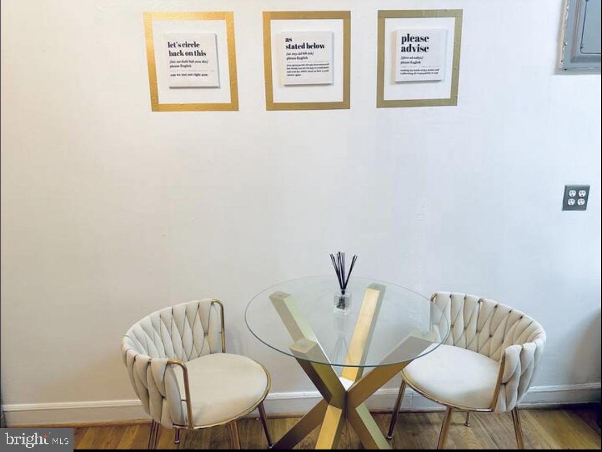 1268 Raum Street Northeast Washington, DC 20002 - Photo 10 of 46 a view of a room with furniture and a chair