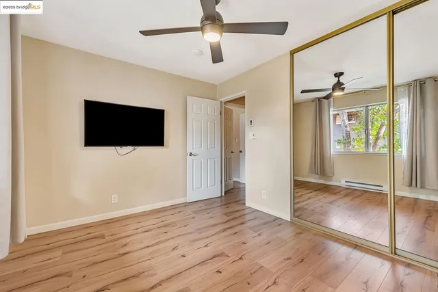 a view of livingroom with hardwood floor and ceiling fan