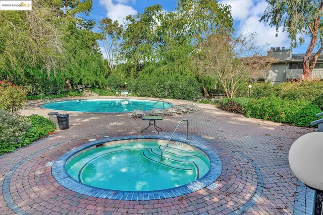 a view of a swimming pool with a yard