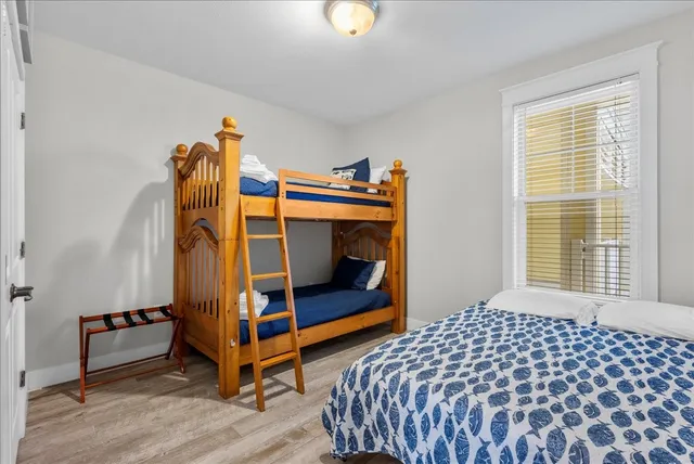 a bedroom with bed and a window