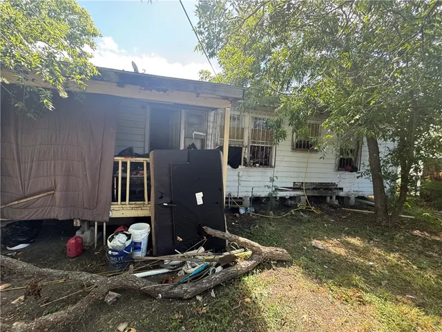 a view of a backyard with large trees