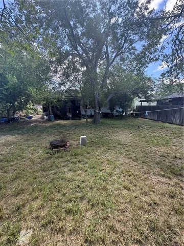 a view of outdoor space with deck and yard