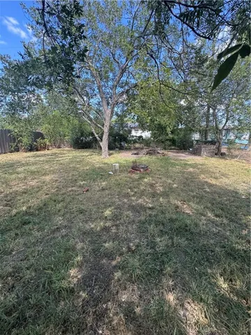 a view of a yard with an outdoor space