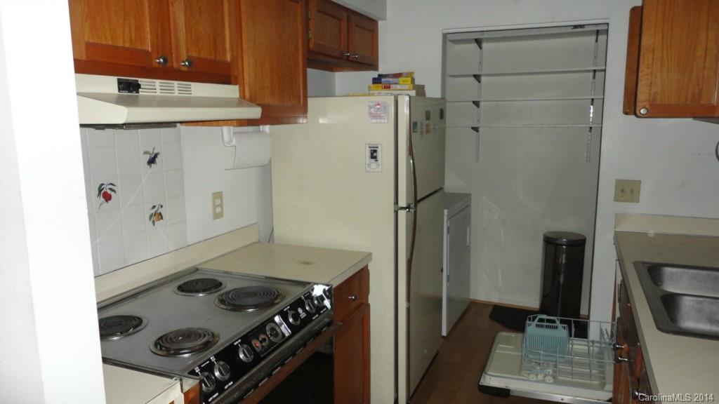 11014 Running Ridge Road, Unit 11014 Charlotte, NC 28226 - Photo 6 of 6 a kitchen with refrigerator and stove