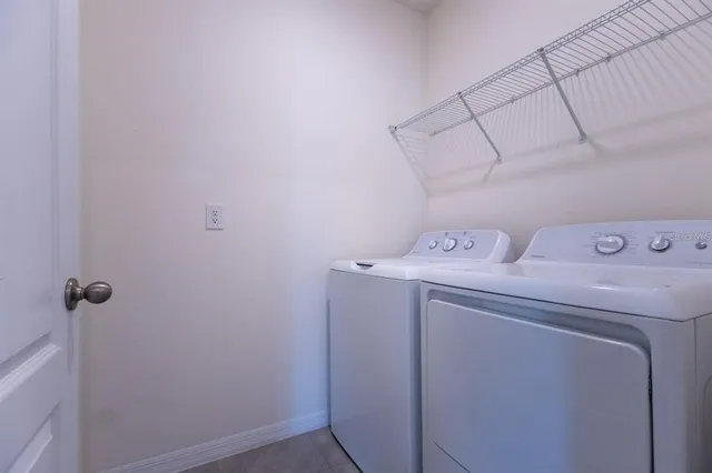 a utility room with dryer and washer