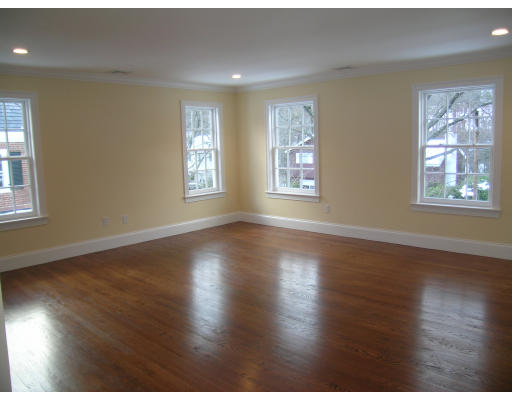 183 Middlesex Road Brookline, MA 02467 - Photo 14 of 16 a view of an empty room with wooden floor and a window
