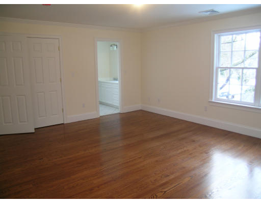 183 Middlesex Road Brookline, MA 02467 - Photo 15 of 16 an empty room with wooden floor and windows