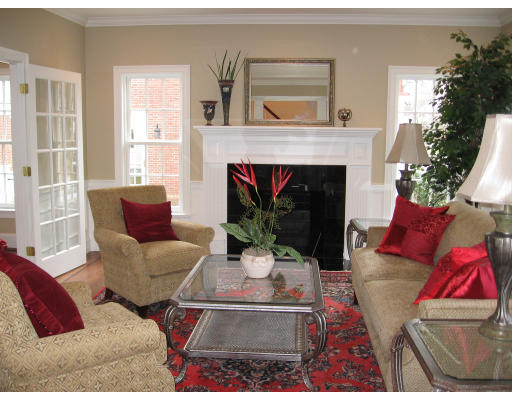 183 Middlesex Road Brookline, MA 02467 - Photo 4 of 16 a living room with furniture and a fireplace