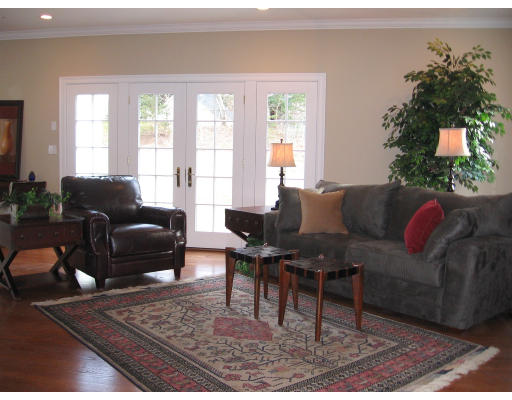 183 Middlesex Road Brookline, MA 02467 - Photo 6 of 16 a living room with furniture potted plant and a window