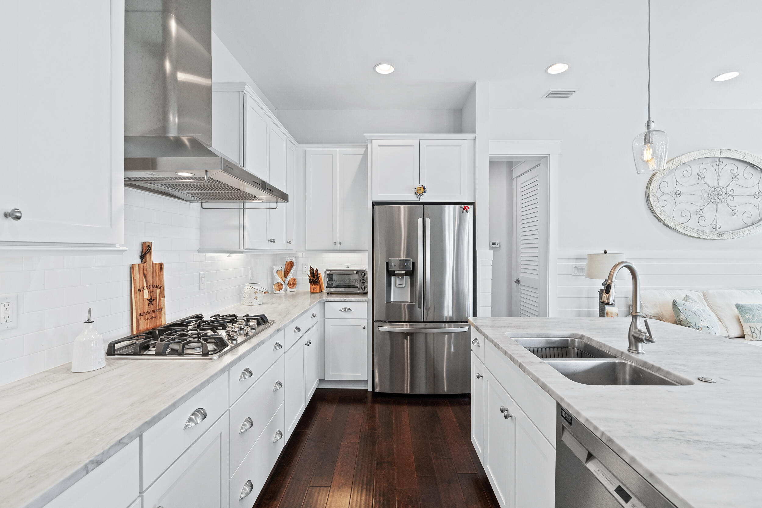 282 Flatwoods Forest Loop Santa Rosa Beach, FL 32459 - Photo 11 of 52 a kitchen with stainless steel appliances granite countertop a sink stove and refrigerator