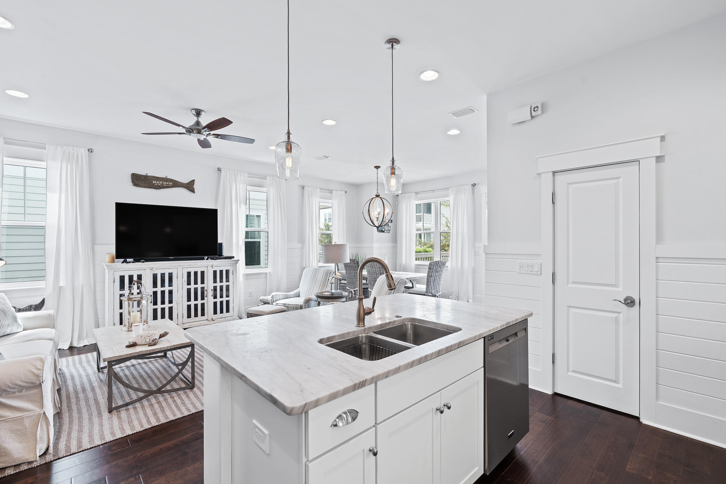 282 Flatwoods Forest Loop Santa Rosa Beach, FL 32459 - Photo 12 of 52 a kitchen with a sink a stove and a living room