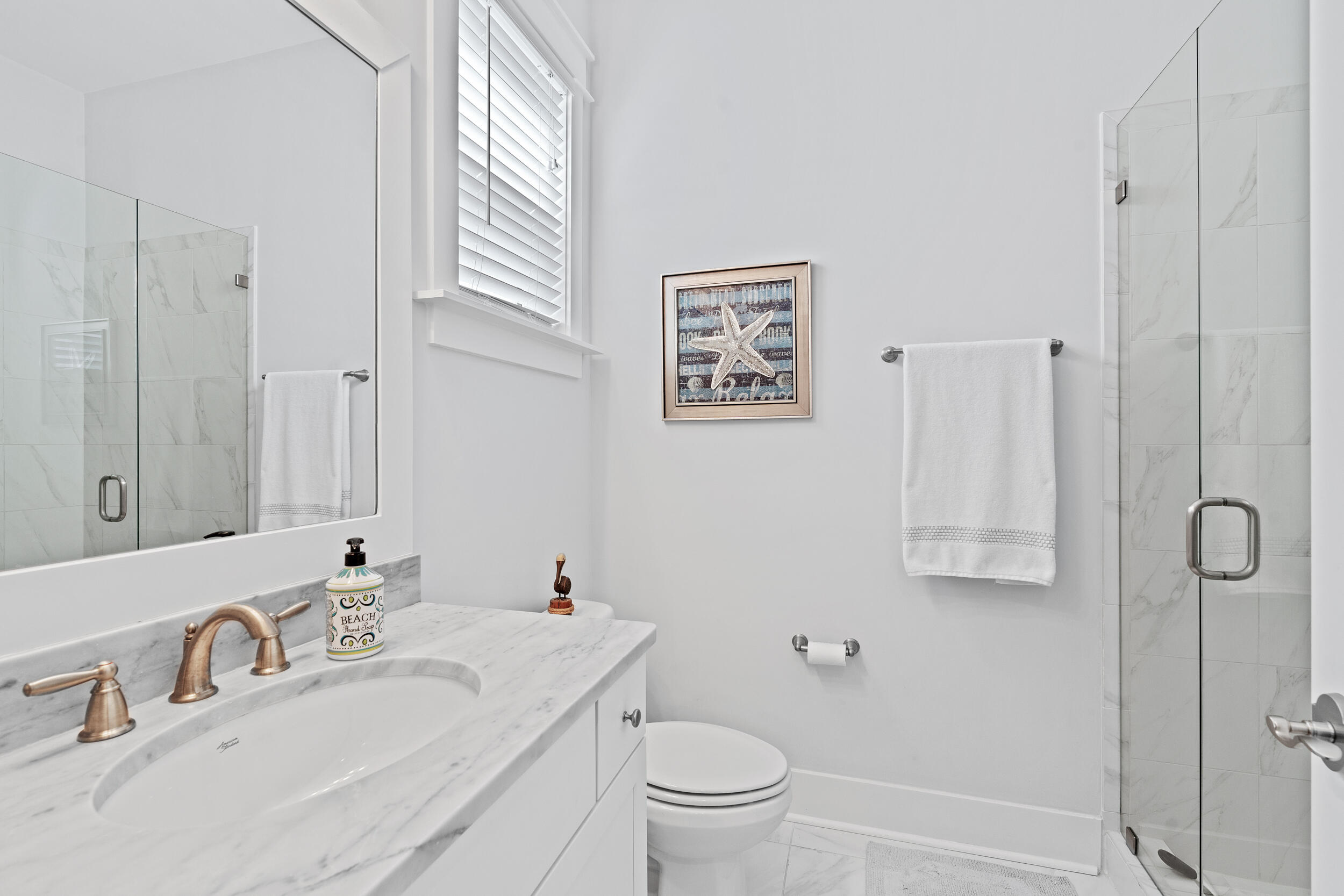282 Flatwoods Forest Loop Santa Rosa Beach, FL 32459 - Photo 15 of 52 a bathroom with a toilet sink and mirror