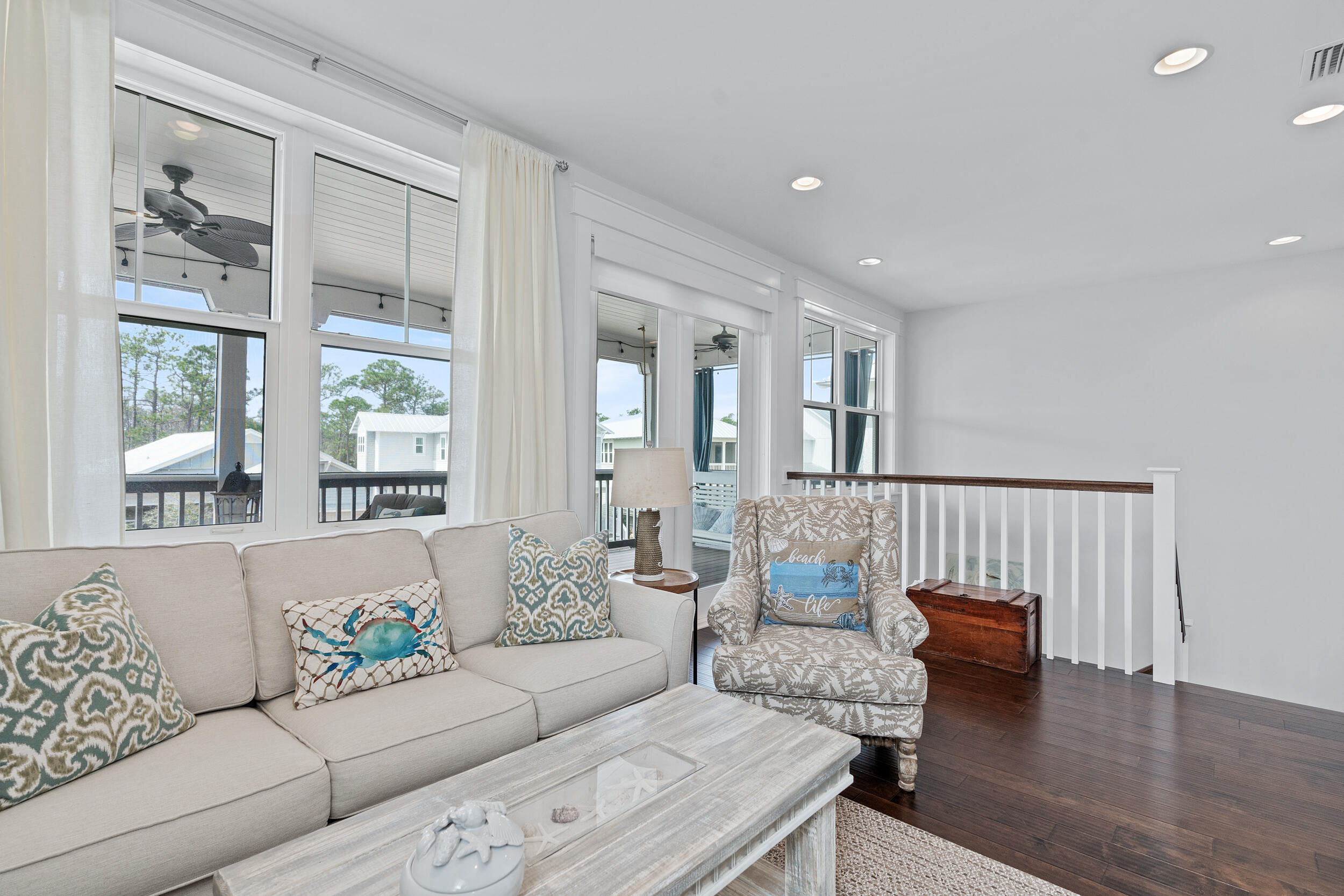 282 Flatwoods Forest Loop Santa Rosa Beach, FL 32459 - Photo 20 of 52 a living room with furniture and a large window