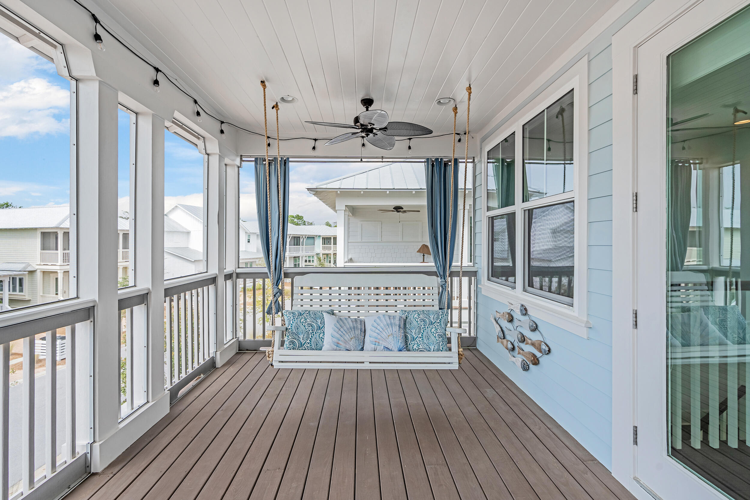 282 Flatwoods Forest Loop Santa Rosa Beach, FL 32459 - Photo 22 of 52 a view of a hallway with wooden floor and windows
