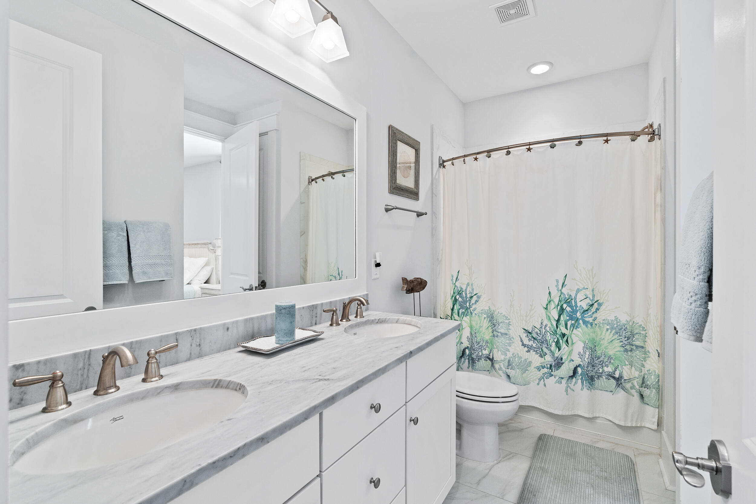 282 Flatwoods Forest Loop Santa Rosa Beach, FL 32459 - Photo 24 of 52 a bathroom with a granite countertop sink a toilet a mirror a vanity and shower