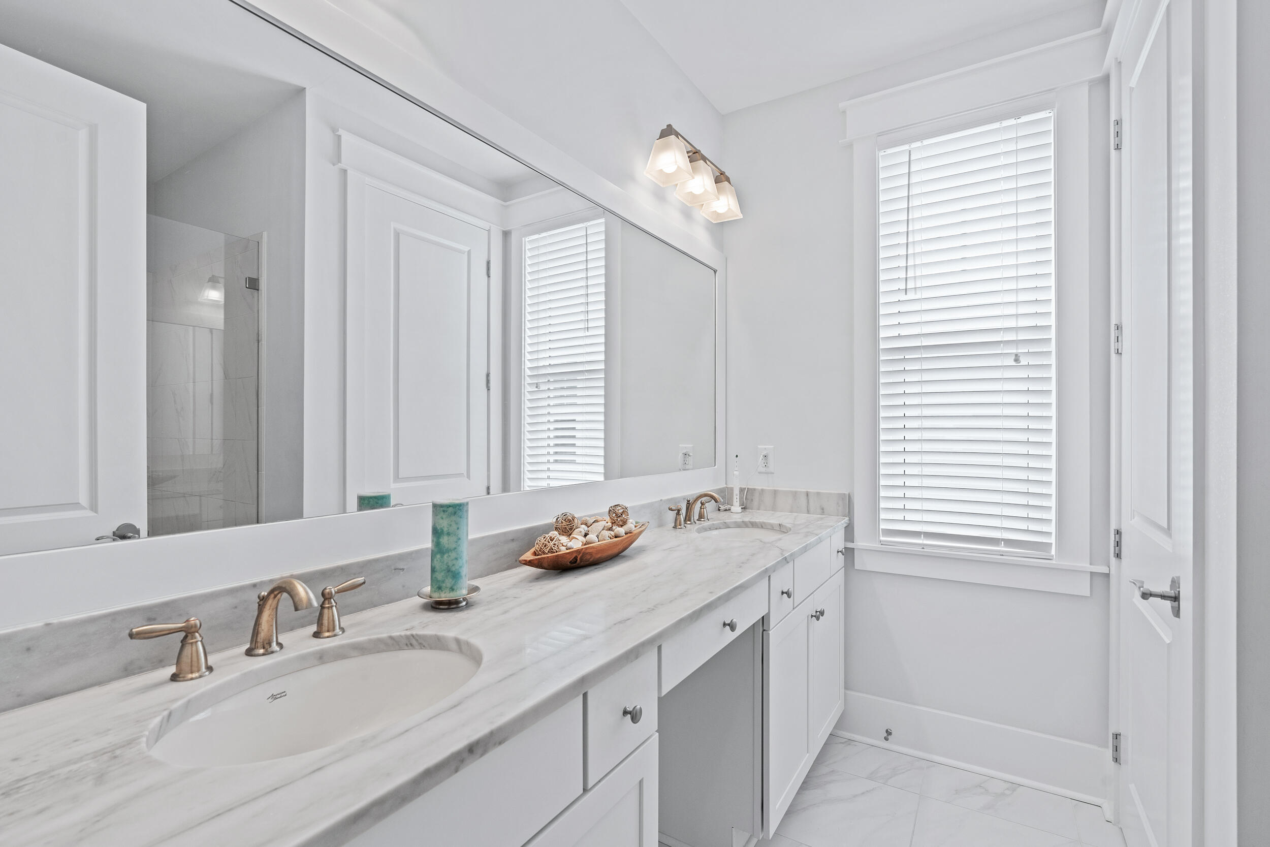 282 Flatwoods Forest Loop Santa Rosa Beach, FL 32459 - Photo 27 of 52 a bathroom with a granite countertop sink and a mirror
