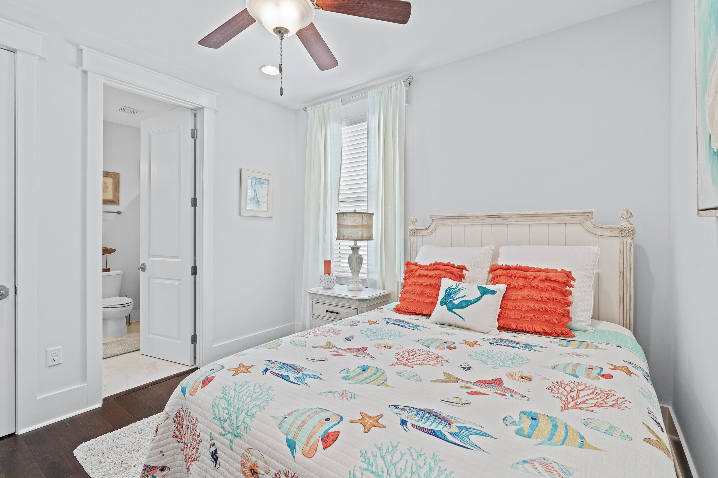 282 Flatwoods Forest Loop Santa Rosa Beach, FL 32459 - Photo 29 of 52 a bedroom with a bed and wooden floor