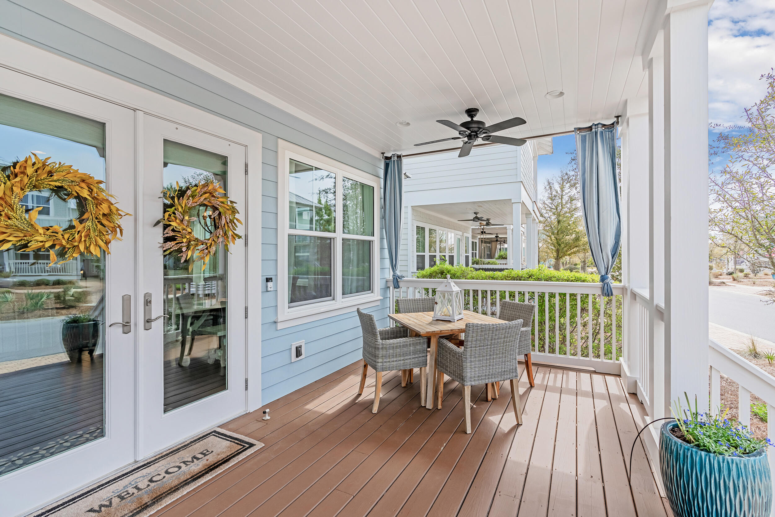 282 Flatwoods Forest Loop Santa Rosa Beach, FL 32459 - Photo 3 of 52 a dining room with furniture a chandelier and wooden floor
