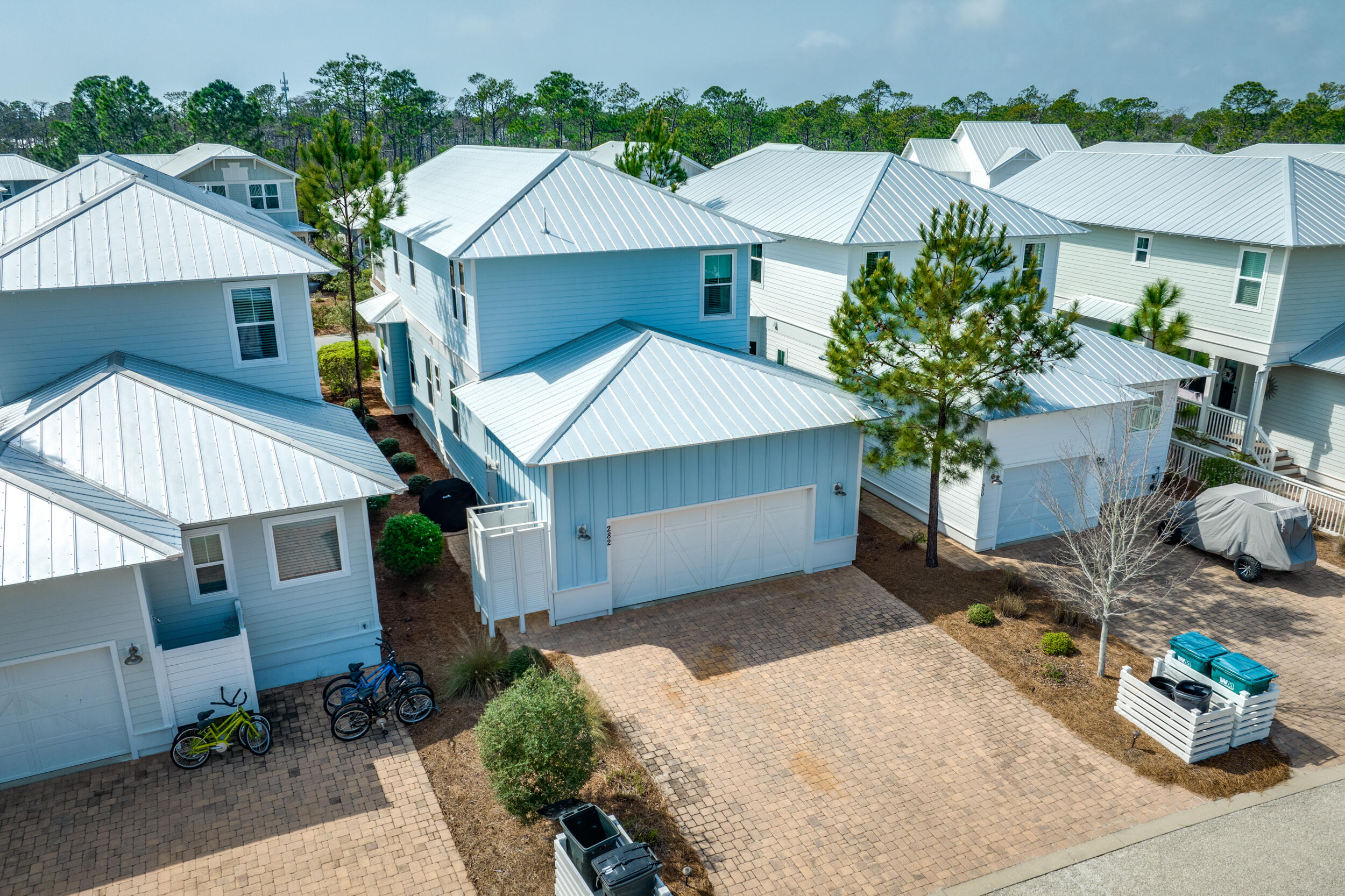 282 Flatwoods Forest Loop Santa Rosa Beach, FL 32459 - Photo 31 of 52 an aerial view of a house with table and chairs under an umbrella
