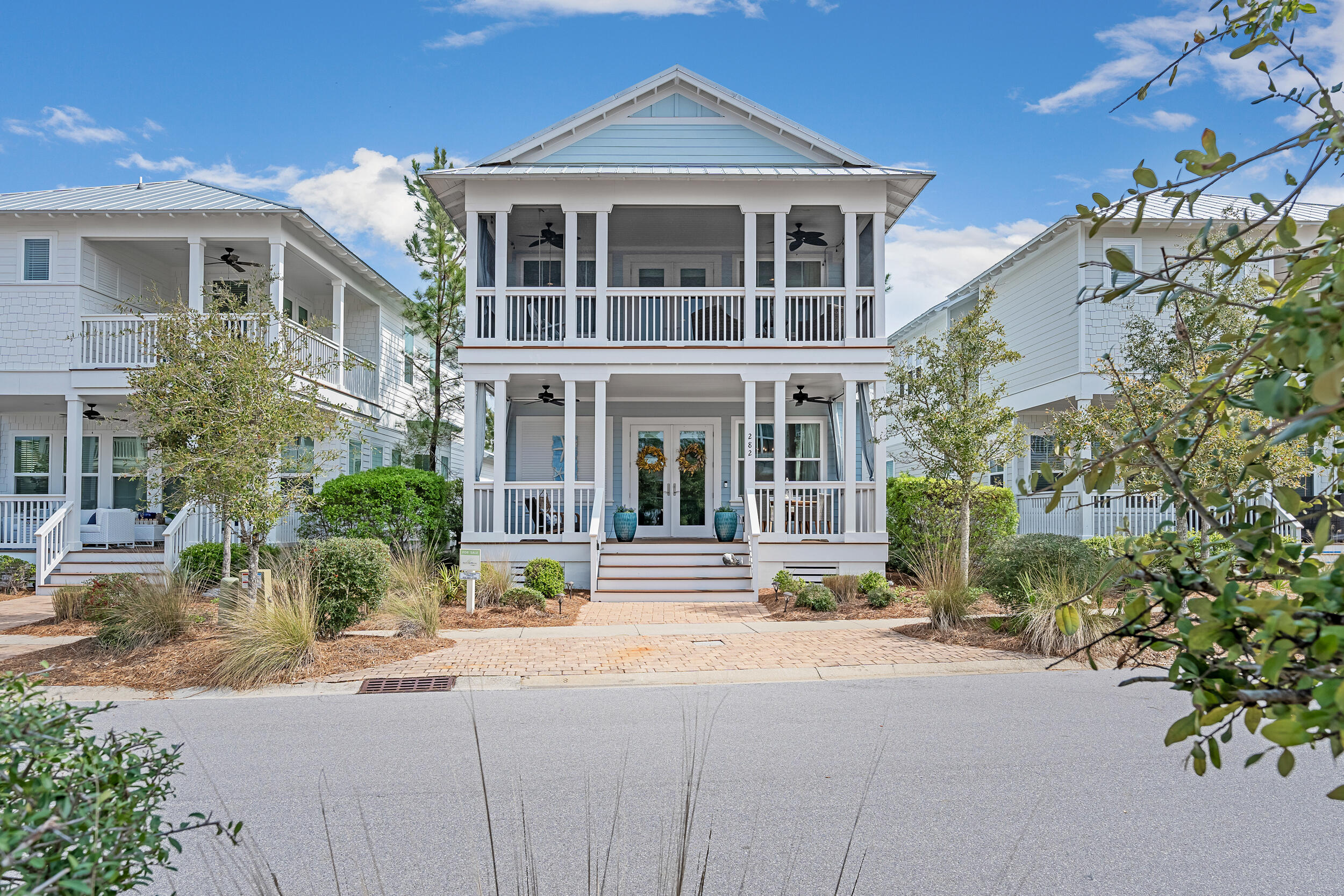 282 Flatwoods Forest Loop Santa Rosa Beach, FL 32459 - Photo 35 of 52 a front view of a house with a yard
