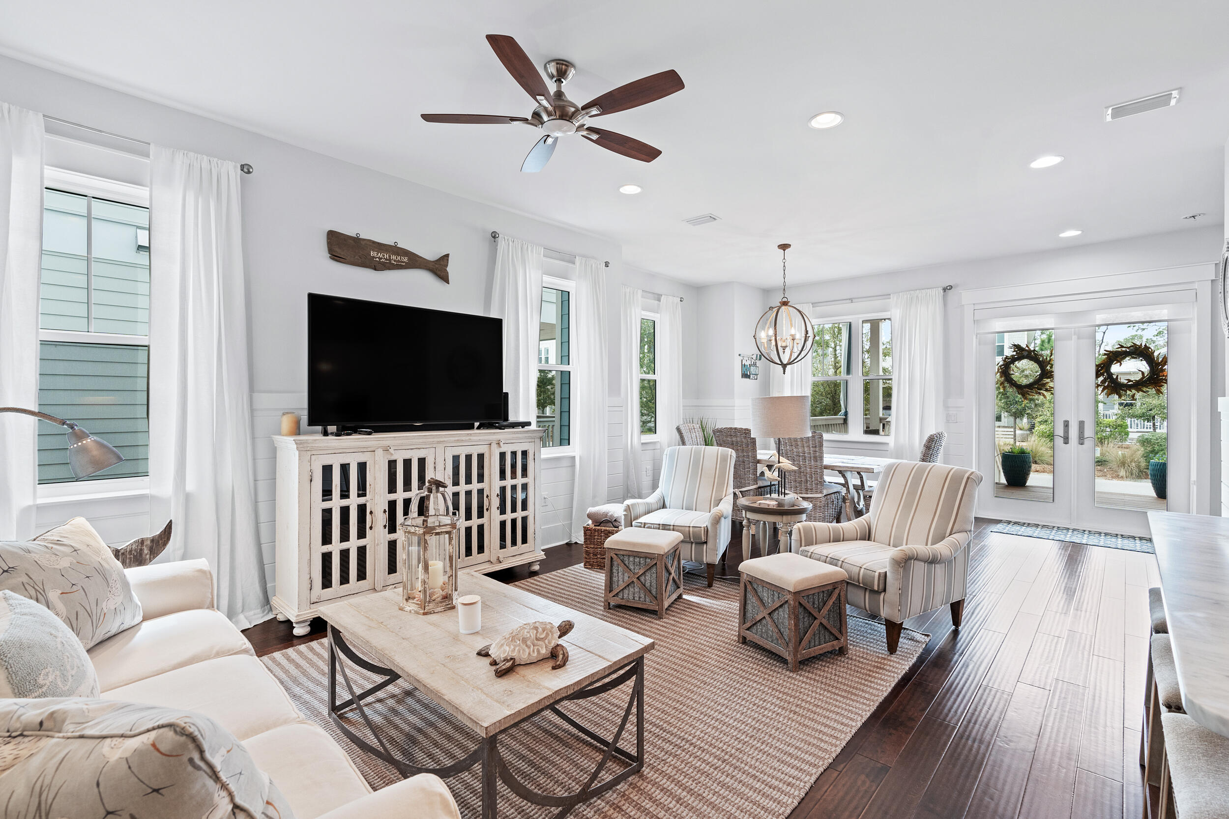 282 Flatwoods Forest Loop Santa Rosa Beach, FL 32459 - Photo 6 of 52 a living room with furniture and a flat screen tv