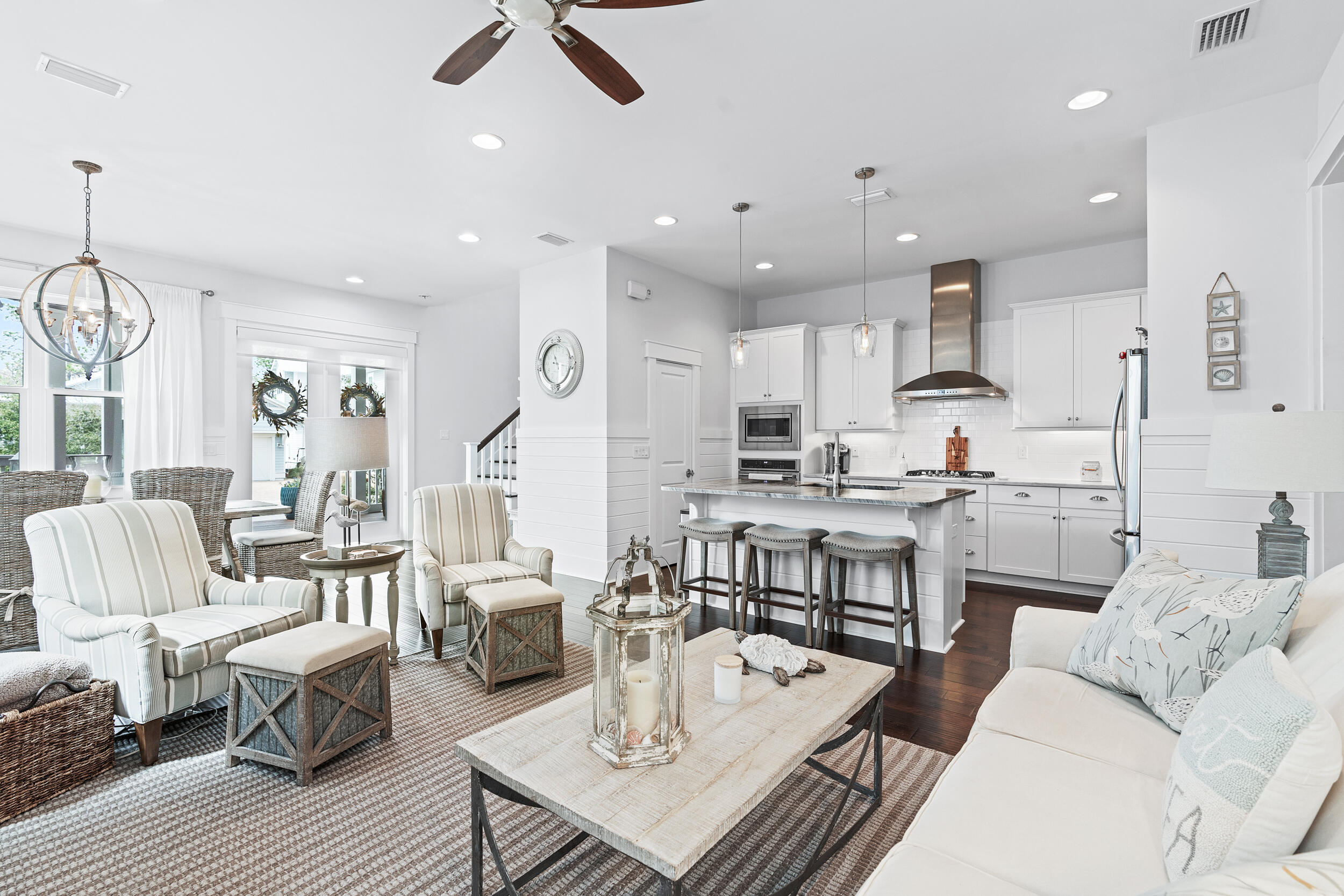 282 Flatwoods Forest Loop Santa Rosa Beach, FL 32459 - Photo 8 of 52 a living room with furniture kitchen view and a wooden floor