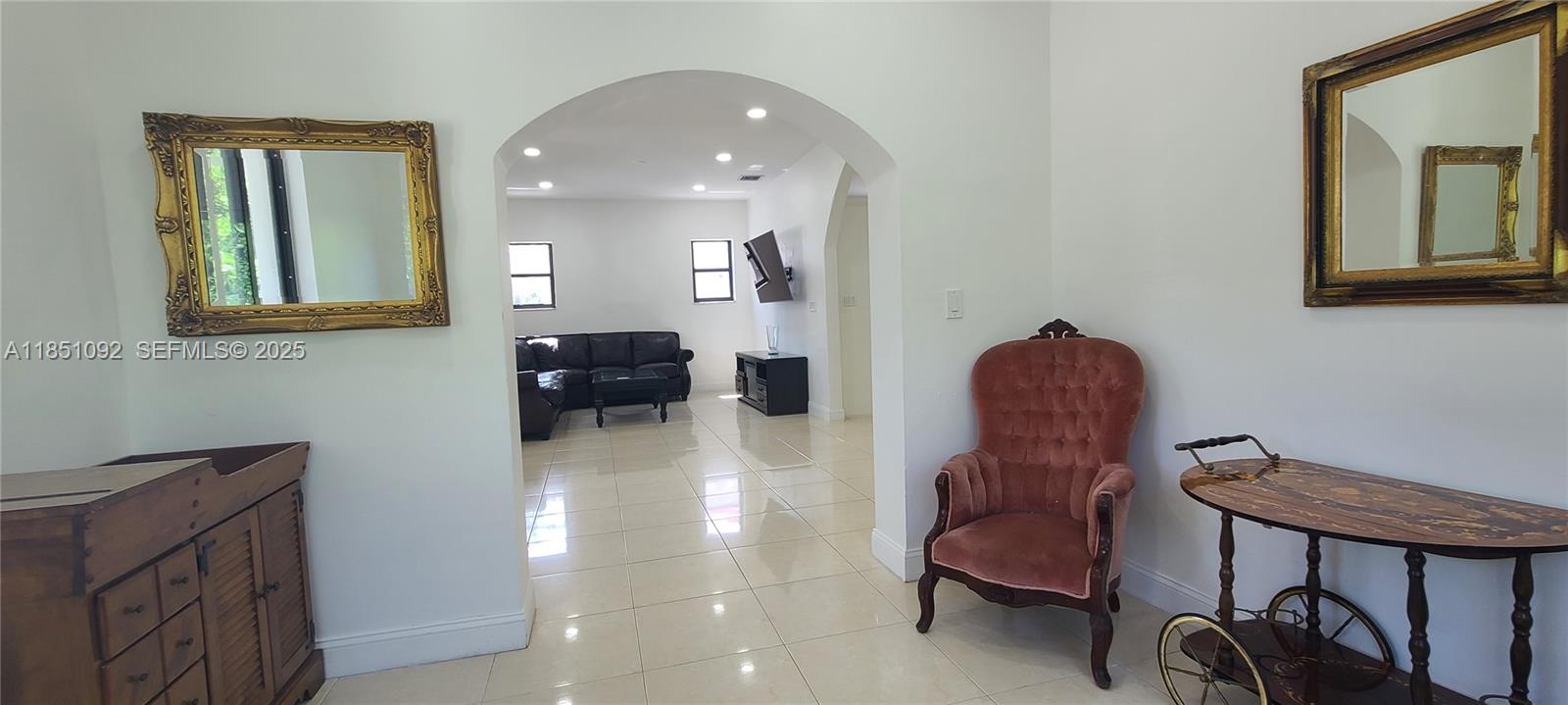 1721 Southwest 24th Terrace Miami, FL 33145 - Photo 11 of 80 a living room with furniture and a chair
