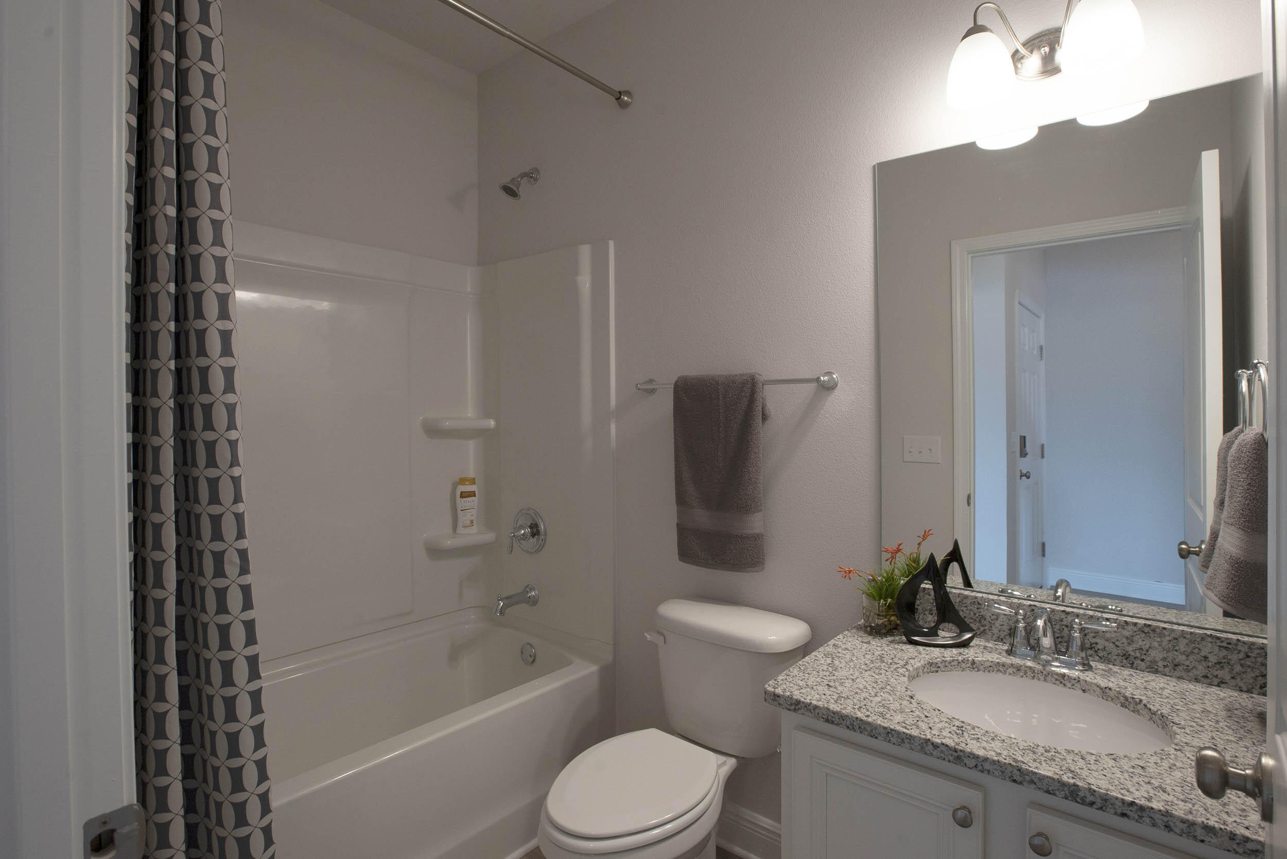 98 Beaver Trl Drive Freeport, FL 32439 - Photo 11 of 18 a bathroom with a granite countertop sink toilet and shower