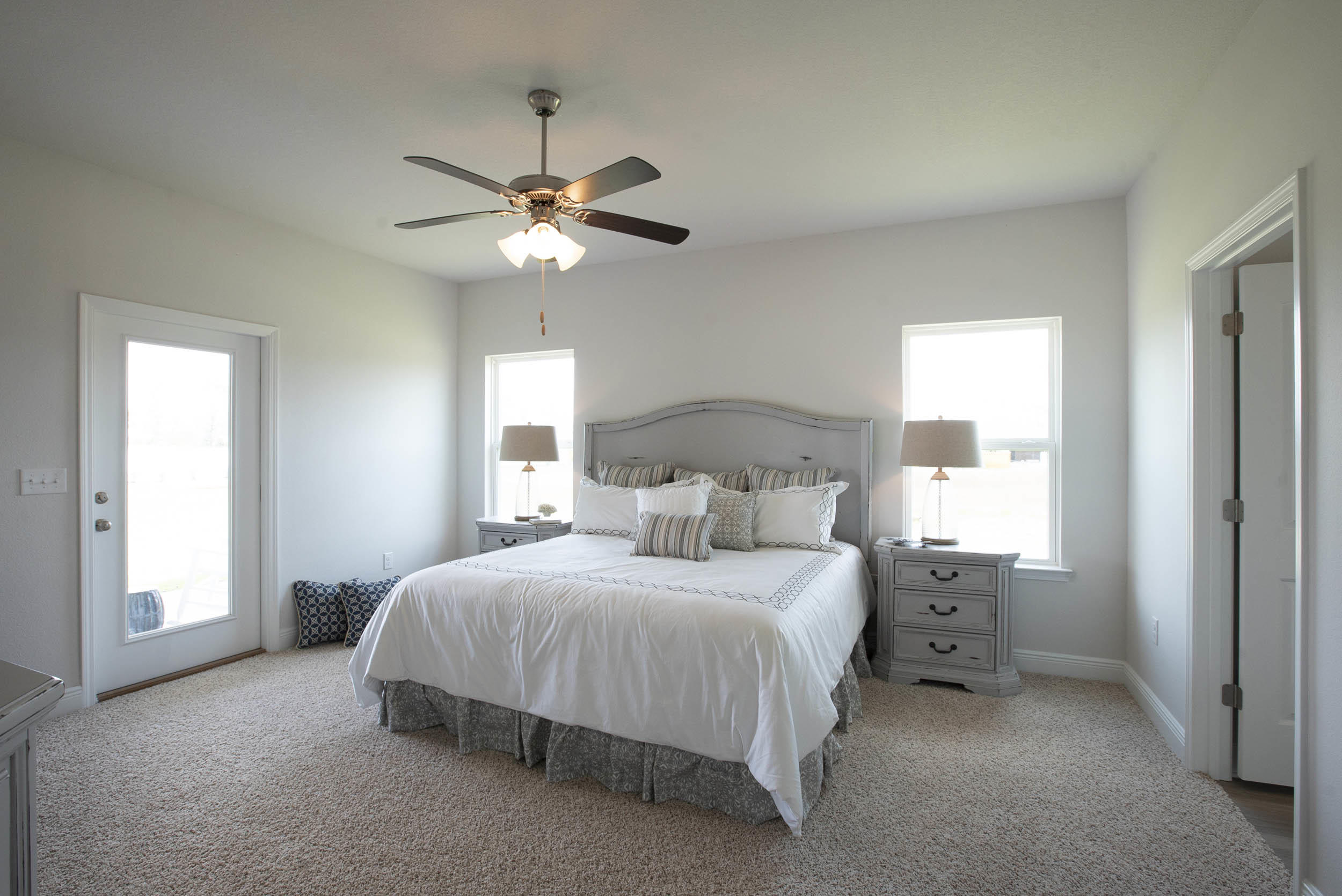 98 Beaver Trl Drive Freeport, FL 32439 - Photo 13 of 18 a bedroom with a bed ceiling fan and a window