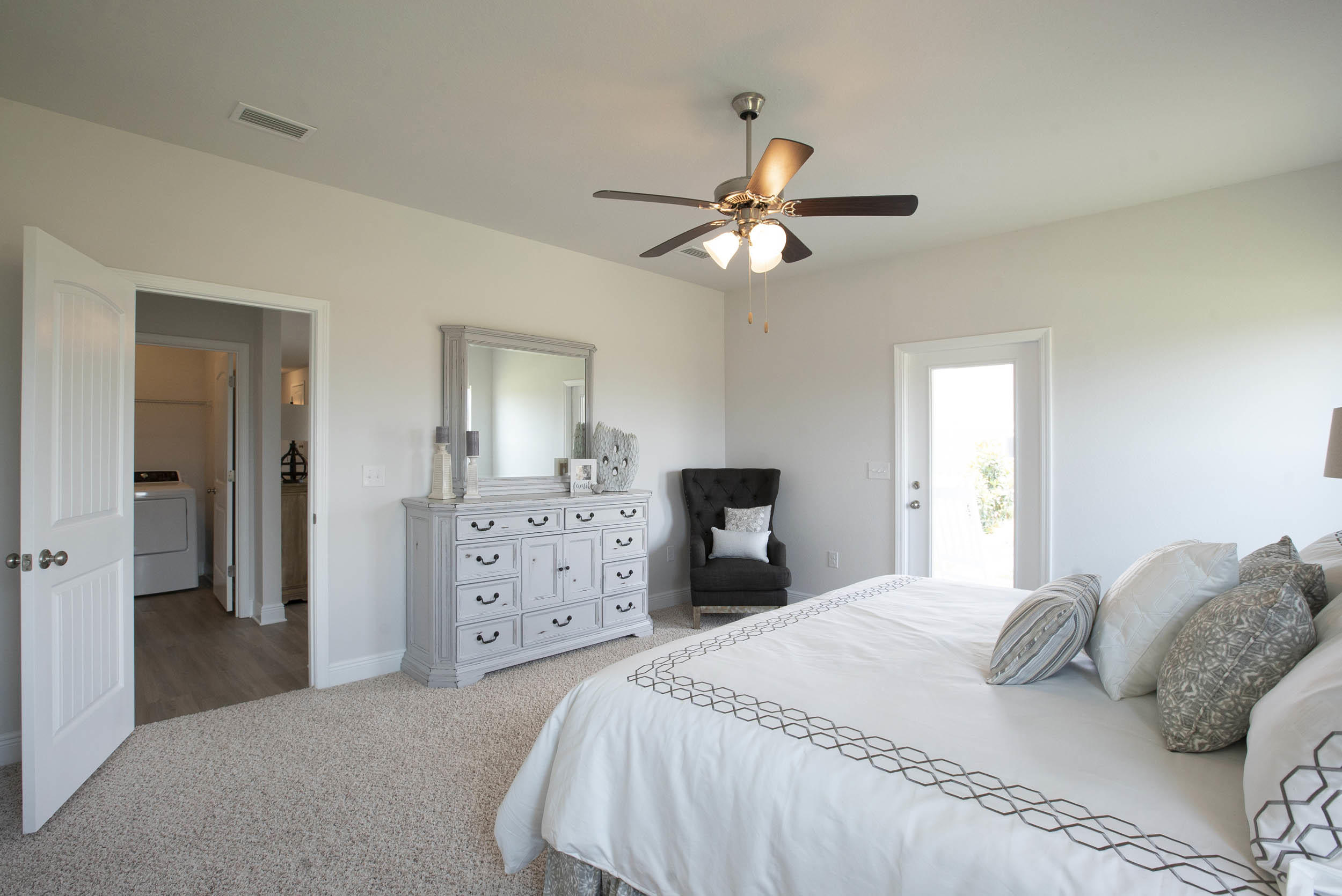 98 Beaver Trl Drive Freeport, FL 32439 - Photo 14 of 18 a bedroom with a bed and a chandelier