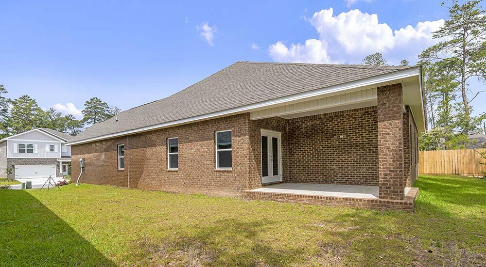 98 Beaver Trl Drive Freeport, FL 32439 - Photo 18 of 18 a front view of a house with a yard