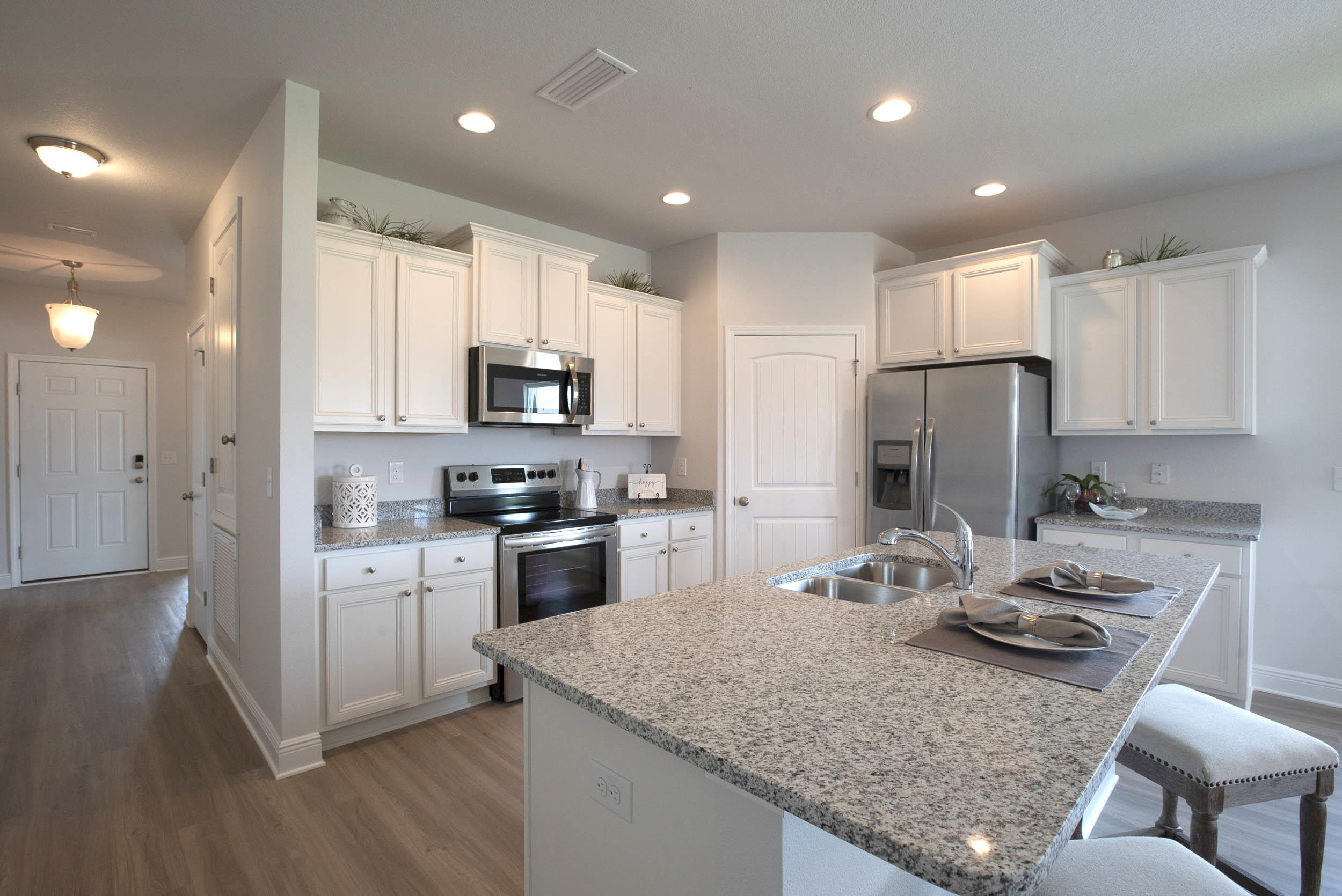 98 Beaver Trl Drive Freeport, FL 32439 - Photo 3 of 18 a kitchen with a refrigerator a stove a sink and a microwave