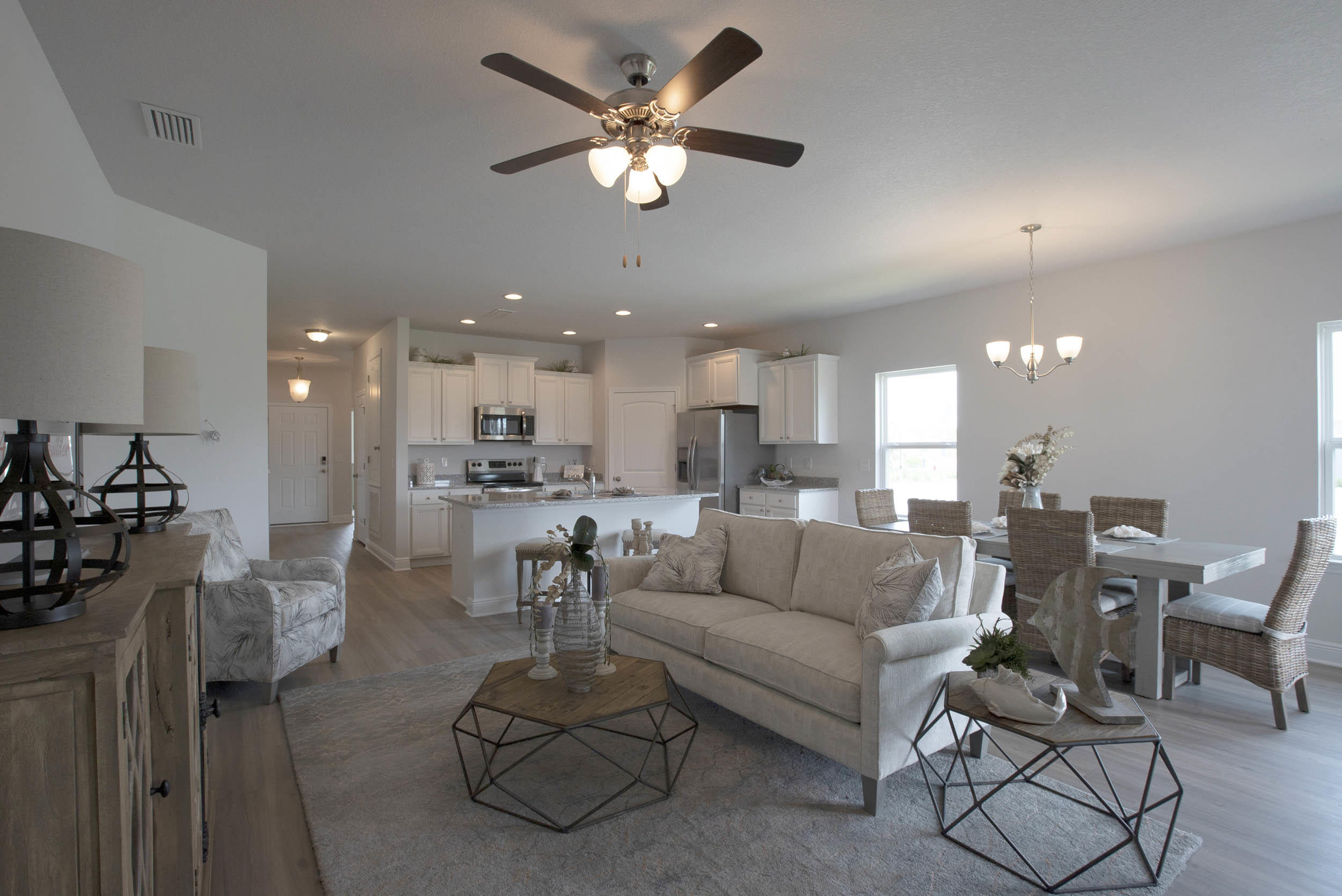 98 Beaver Trl Drive Freeport, FL 32439 - Photo 5 of 18 a living room with furniture kitchen view and a chandelier