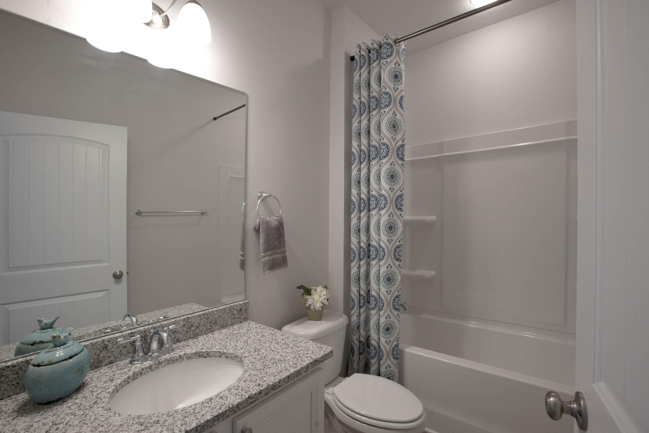 98 Beaver Trl Drive Freeport, FL 32439 - Photo 8 of 18 a bathroom with a granite countertop sink toilet and shower