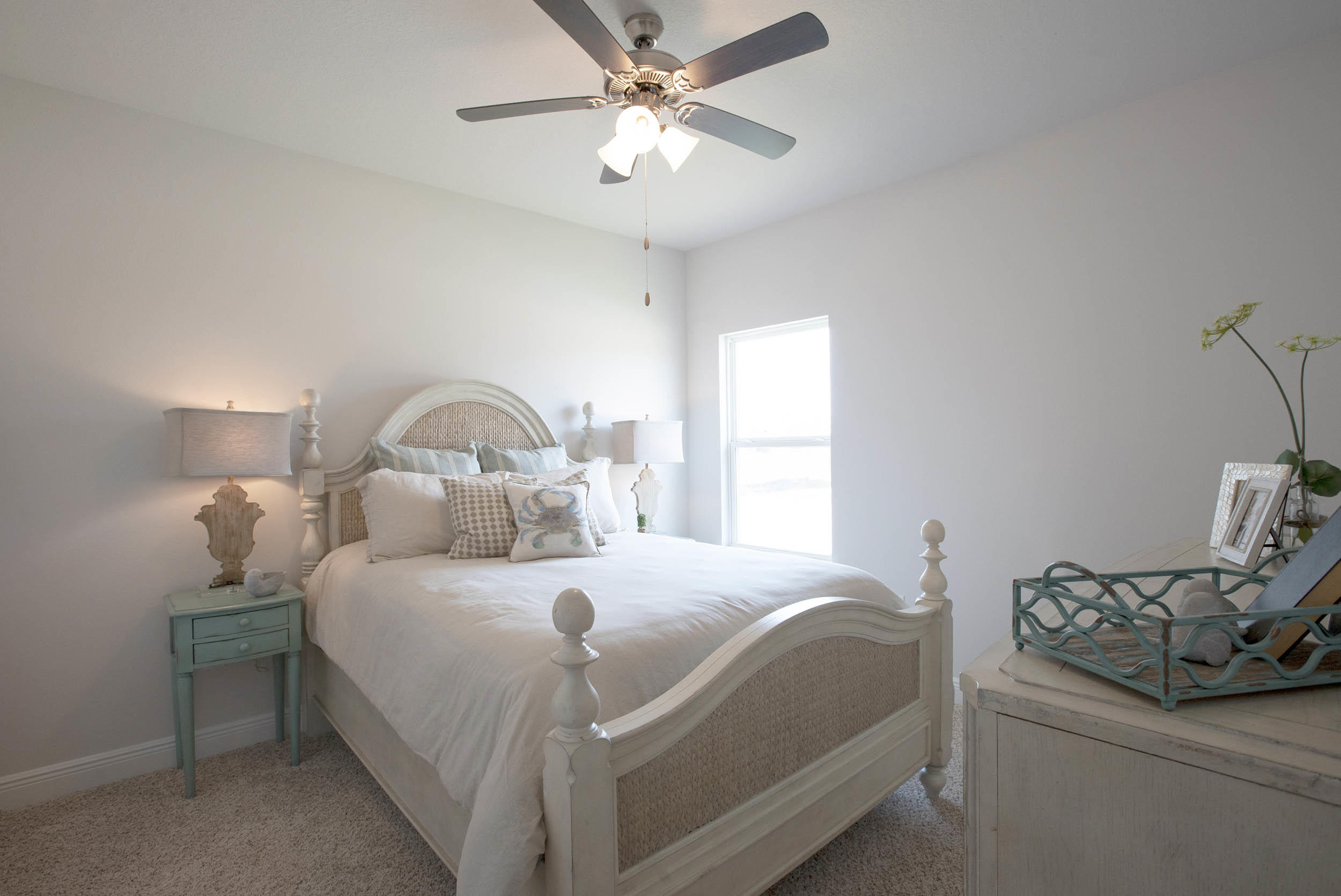 98 Beaver Trl Drive Freeport, FL 32439 - Photo 9 of 18 a bedroom with a bed and a chandelier