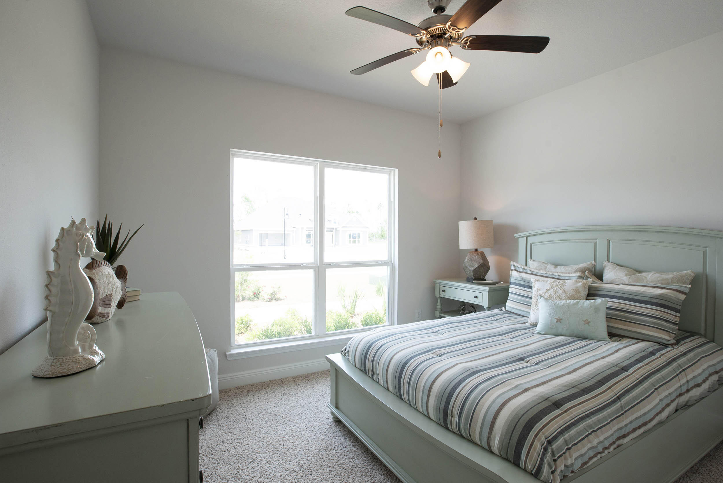98 Beaver Trl Drive Freeport, FL 32439 - Photo 10 of 18 a bedroom with a bed and window