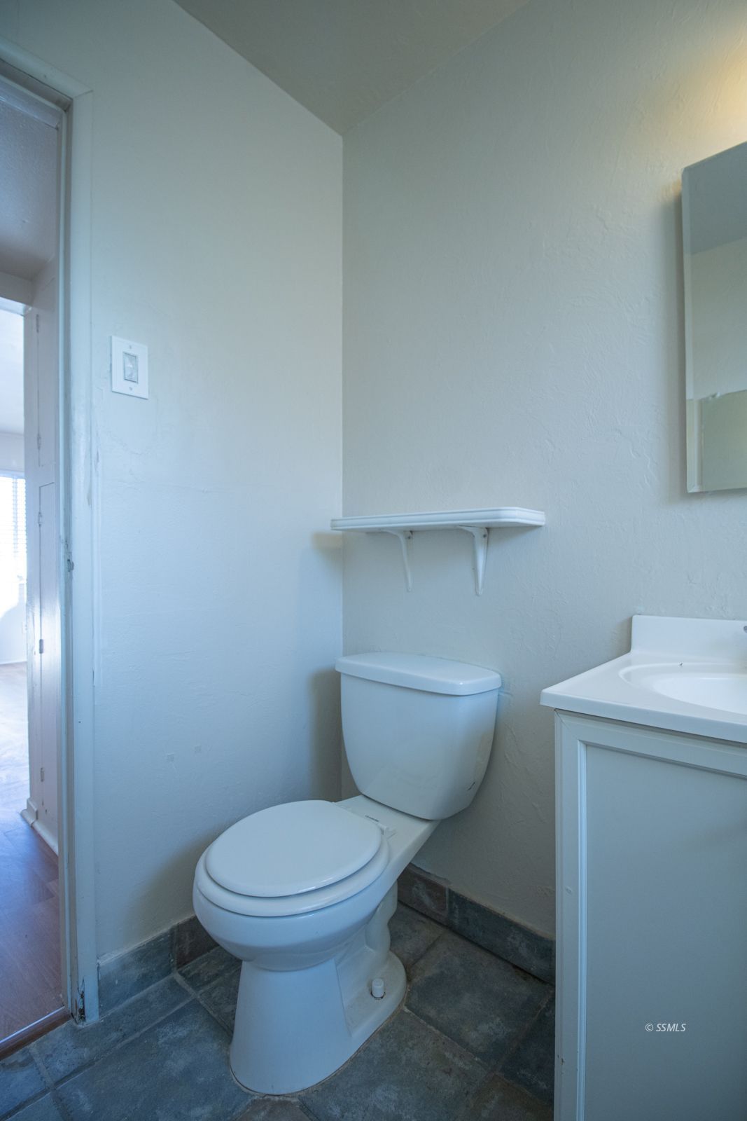 1621 Sims Street Ridgecrest, CA 93555 - Photo 20 of 24 a bathroom with a toilet and a sink