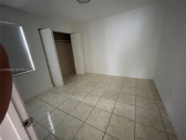 an empty room with a bathroom