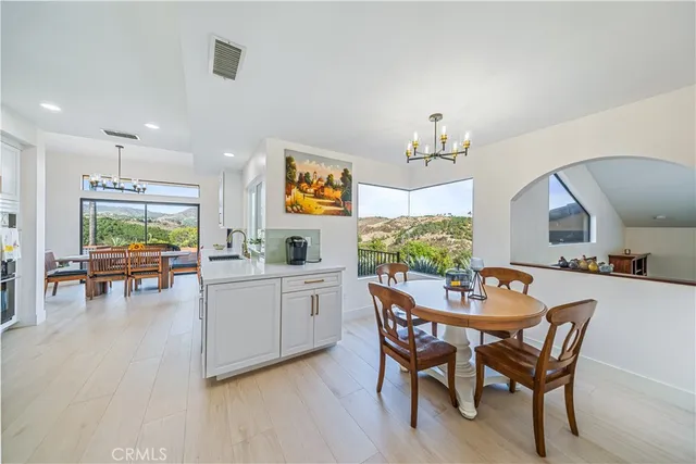 a view of a dining room with furniture and a livingroom