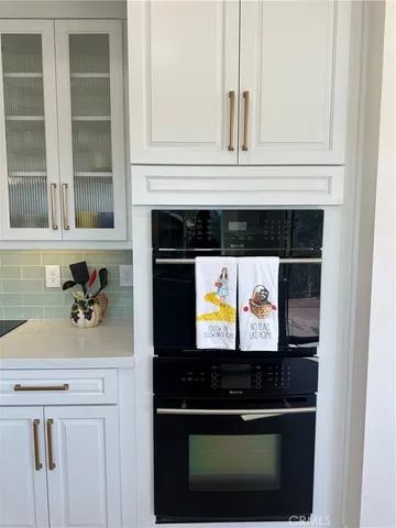 a kitchen with a stove and a microwave